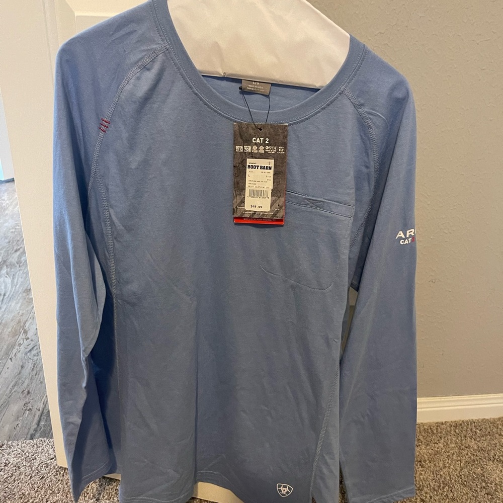 Light blue Ariat long sleeve shirt.